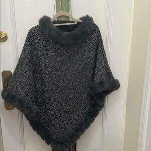Gray Faux Fur Poncho with trim. Interior completely faux fur lined!